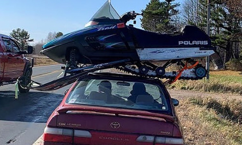 Wisconsin Trooper Stops Driver Hauling Snowmobile Atop Car
